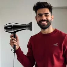 سشوار حرفهای وی جی ار مدل V-414، موتور AC با توان مصرفی 2200 وات، دارای فناوری تولید یون، دارای حلقه آویختن، با حالت صافکننده و حجمدهنده، وزن 802 گرم، تنظیم حرارت 3 حالته و کنترل سرعت 2 حالته، به همراه 3 عدد سری متمرکزکننده